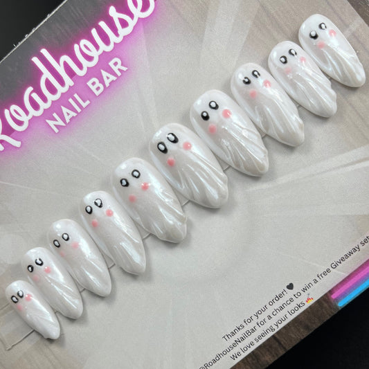 Hand-painted Halloween ghost press-on nails, spooky-cute white ghost nail art, reusable 10-piece custom false nail set, made in the UK.