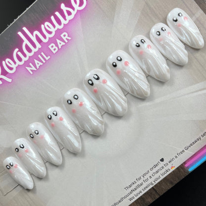 Hand-painted Halloween ghost press-on nails, spooky-cute white ghost nail art, reusable 10-piece custom false nail set, made in the UK.